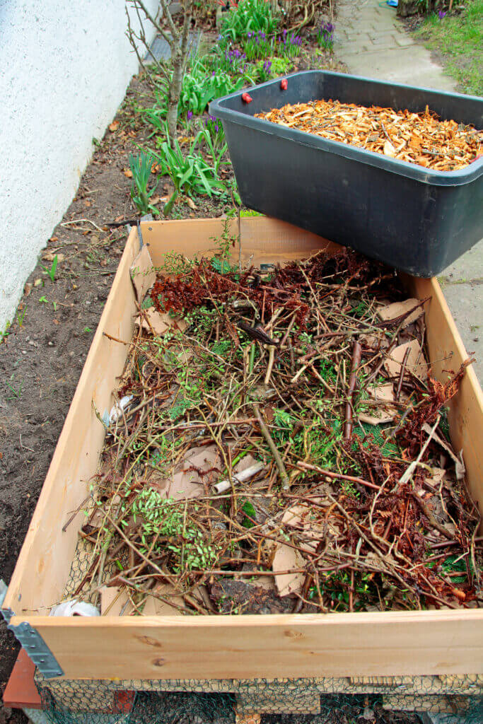 twigs and leaves in a raised bed